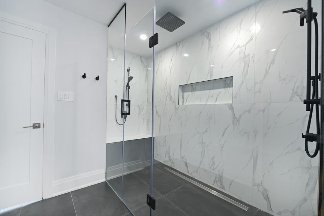 Elegant bathroom with glass shower — Litani Bathrooms